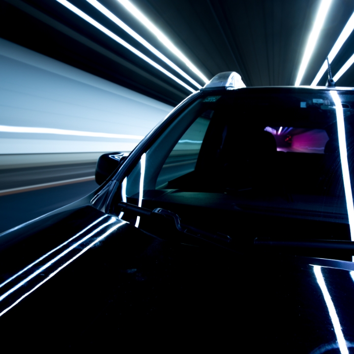 Automotive fast-driving car with light reflections 